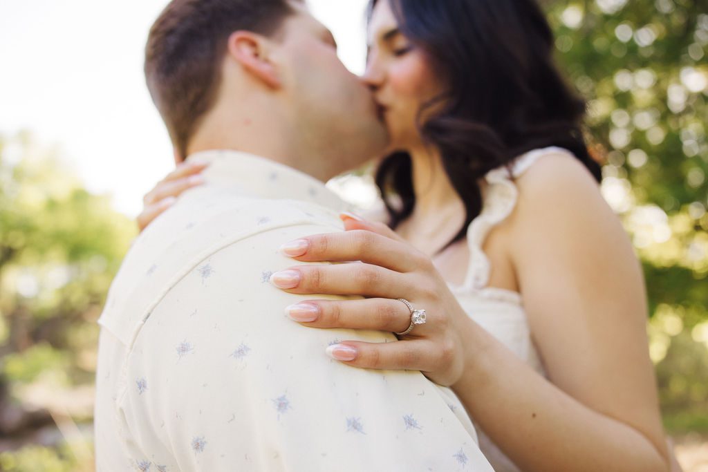 close up of couple kissing for engagement photos at Bull Creek District Park in Austin TX