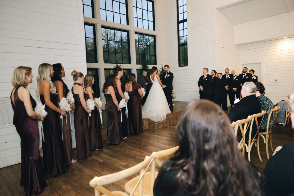 indoor winter wedding ceremony at Morgan Creek Barn in Dripping Springs TX